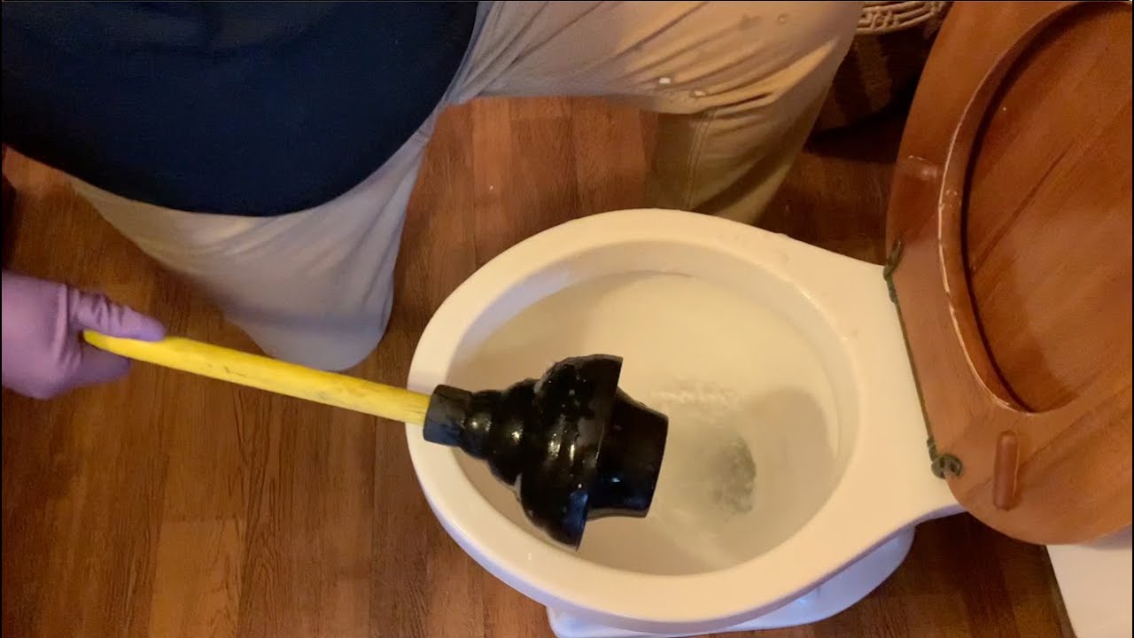 clogged toilet plunger not working